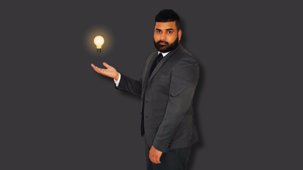 Portrait of Mo M. Uddin gazing at the camera, with a levitating light bulb above his hands, symbolizing creativity and inspiration.