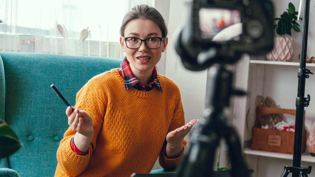 Individual speaking into a camera, conveying ideas and insights, symbolizing engagement and communication.